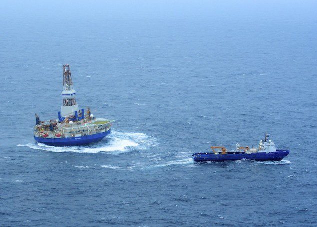 The tug Nanuq and the tug Aiviq (not pictured) tow the mobile drilling unit Kulluk in 15 to 20-foot seas. U.S. Coast Guard photo by Petty Officer 1st Class Sara Francis.