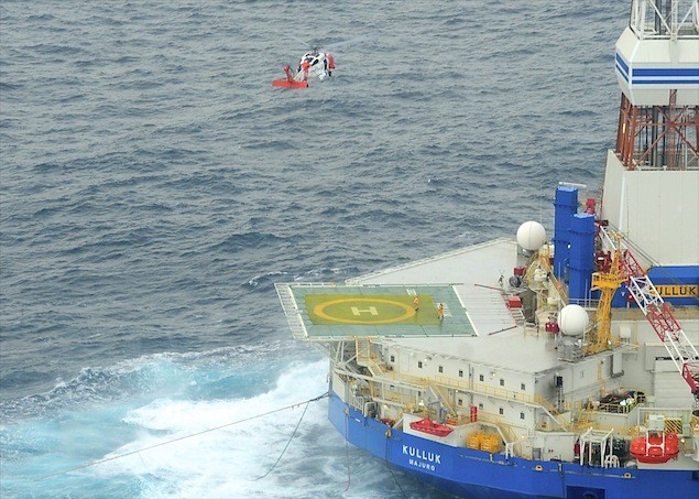 The crew of an MH-60 Jayhawk helicopter from Coast Guard Air Station Kodiak prepares to hoist the first of 18 crewmen aboard the mobile drilling unit Kulluk 80 miles southwest of Kodiak City, Alaska, in the Pacific Ocean, Saturday, Dec. 29, 2012. The Kulluk was being towed by the tug Aiviq from Dutch Harbor, Alaska, to Everett, Wash., when the towline parted and the tug suffered several engine failures prompting the deplyment of response assets form the Coast Guard and Royal Dutch Shell. U.S. Coast Guard photo by Petty Officer 1st Class Sara Francis.