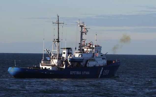 A Russian Coast Guard vessel fires a warning shot. Image (c) Greenpeace